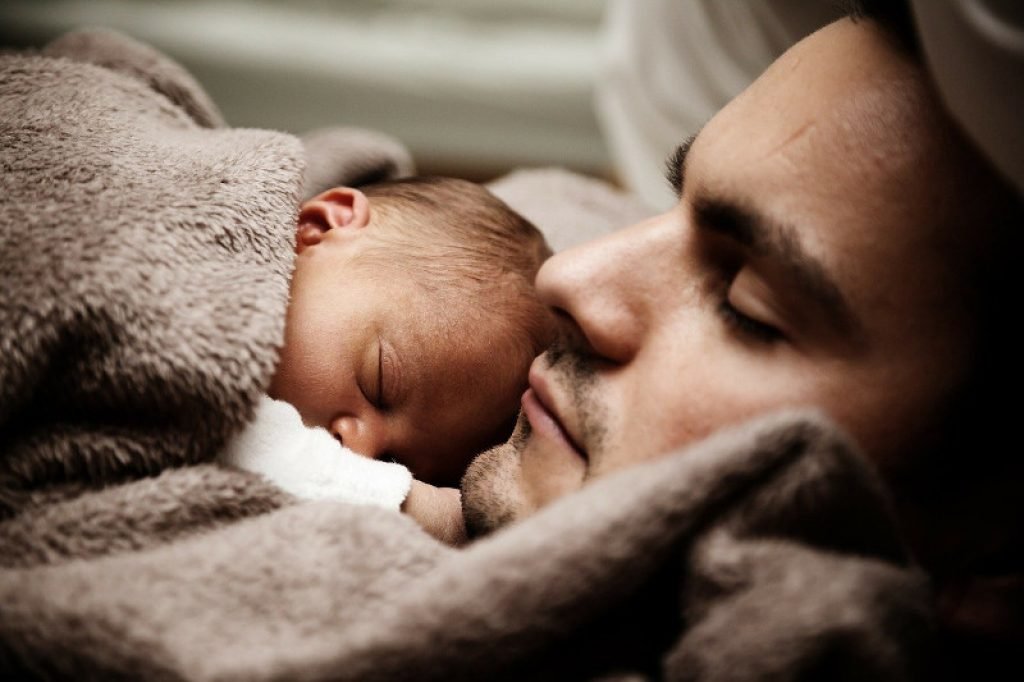 Father and child sleeping soundly